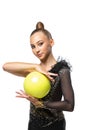 Close-up portrait of young rhythmic gymnastics artist in stage costume isolated on white studio background. Concept of