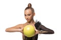 Close-up portrait of young rhythmic gymnastics artist in stage costume isolated on white studio background. Concept of