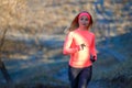Close up portrait of young running woman in park in frosty morning Royalty Free Stock Photo