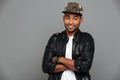 Close-up portrait of young smiling african man in stylish cap st Royalty Free Stock Photo