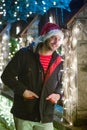 Close up portrait of young smiling man, with santa claus cap sta Royalty Free Stock Photo