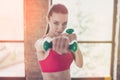 Close up portrait of young sportwoman concentrated on her work o