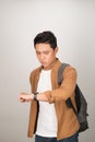 Close up of portrait of young student watching the clock Royalty Free Stock Photo