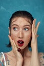 Close-up portrait of young surprised woman with cherry berries