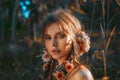 Close up portrait of young and tender woman on a feild at sunset