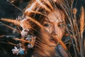 Close up portrait of young and tender woman on a feild at sunset Royalty Free Stock Photo