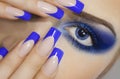 Close up portrait of young woman with big blue eyes and prefect manicure. Royalty Free Stock Photo