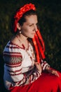 Walks in nature in the countryside. Close-up portrait of a young woman in a blooming garden. A girl in a national