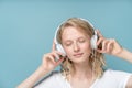 Close up Portrait of young woman closed eyes listening music via headphones Royalty Free Stock Photo