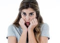 Young attractive woman looking scared, frightened and shocked. Human expressions and emotions Royalty Free Stock Photo