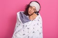 Close up portrait of young woman at home, just from bed, drinking good tea or coffee, being in her bedroom covered with blanket, Royalty Free Stock Photo