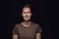 Close up portrait of young woman isolated on black studio background Royalty Free Stock Photo