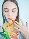 Close up portrait of young woman with paints Royalty Free Stock Photo