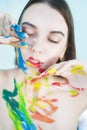 Close up portrait of young woman with paints Royalty Free Stock Photo