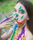 Close up portrait of young woman with paints Royalty Free Stock Photo