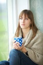 Young Woman Relaxing with Cup of Tea Royalty Free Stock Photo