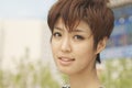 Close up portrait of young woman with short hair smiling Royalty Free Stock Photo