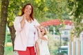 Close up portraits of mother and daughter have fun together in the Park. Concept of single mothers and family vacations