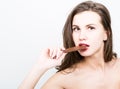 Close-up portret of beautiful woman with red lips eating chocolate Royalty Free Stock Photo