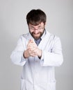 Close-up portret of a Doctor, stethoscope around his neck. He gleefully rubbing his hands. different emotions Royalty Free Stock Photo