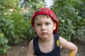 Close up portret of little beautiful boy in a red cap Royalty Free Stock Photo