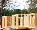 Close-up post, beam and timber framing new suburban wooden house with OSB Oriented Strand Board plywood sheathing Flowery Branch, Royalty Free Stock Photo