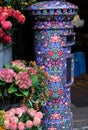 Close up of post box covered in Liberty print, located in the flower shop outside Liberty of London store.