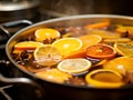 Close-up of a pot of mulled wine, process of cooking warming red wine drink. Home made mulled red wine or punch drink with spices