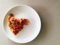 Pizza pice paste on white dish