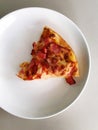 Pizza pice paste on white dish