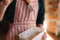 Close up of potter`s hands making ornament on ceramic product. Plate in male`s hands. Young artist Royalty Free Stock Photo