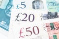 Close-up of 5, 20 and 50 pound sterling England currency banknotes, Brexit, UK United Kingdom economics, saving, financial or