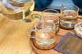 Close up Pour the tea from the kettle into a cup of tea on the table Royalty Free Stock Photo