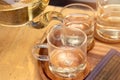 Close up Pour the tea from the kettle into a cup of tea on the table Royalty Free Stock Photo