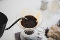 Close up poured water drip coffee into the cup with equipment, tool brewing at kitchen home Royalty Free Stock Photo