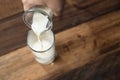 Close up - pouring milk into glass Royalty Free Stock Photo