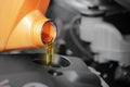 Close up, Pouring motor oil to car engine. Royalty Free Stock Photo