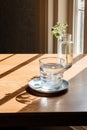 Close up pouring purified fresh drink water from the bottle on table in living room Royalty Free Stock Photo