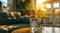 close up of pouring purified fresh drink water from bottle on table in living room, refreshing hydration concept