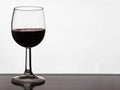 Close up of pouring of red dry wine in a crystal wine glass Royalty Free Stock Photo