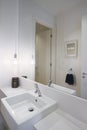 Close up of powder room basin tap and pendant lighting