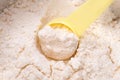 Close up of powdered milk and spoon for baby on white background