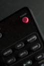 Close-up of Power button on - off on remote control for TV and audio in black color. With copy space Royalty Free Stock Photo