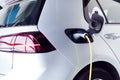 Close Up Of Power Cable Charging Environmentally Friendly Zero Emission Electric Car In Garage Royalty Free Stock Photo