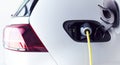 Close Up Of Power Cable Charging Environmentally Friendly Zero Emission Electric Car In Garage Royalty Free Stock Photo