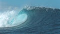 CLOSE UP: Powerful Cloudbreak wave violently swirls in awesome sunny weather.