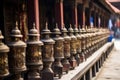 close-up of prayer wheels in a temple courtyard