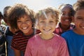 Close up of pre-teen friends in a park smiling to camera Royalty Free Stock Photo