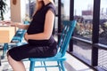 Close Up Of Pregnant Businesswoman Sitting At Desk In Modern Office Using Laptop Royalty Free Stock Photo
