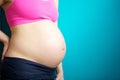 Close up pregnant female stomach Royalty Free Stock Photo